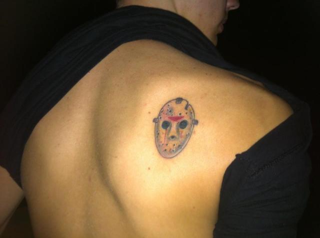 Small Simple Jason Mask Tattoo On Right Back Shoulder