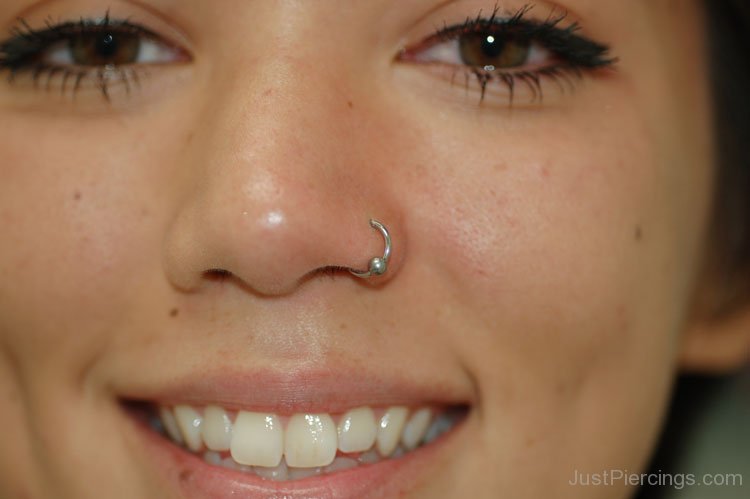 Smiling Girl With Nostril Piercing With Silver Bead Ring