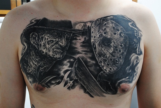 Superb Black Ink Jason Vs Freddy Tattoo On Chest