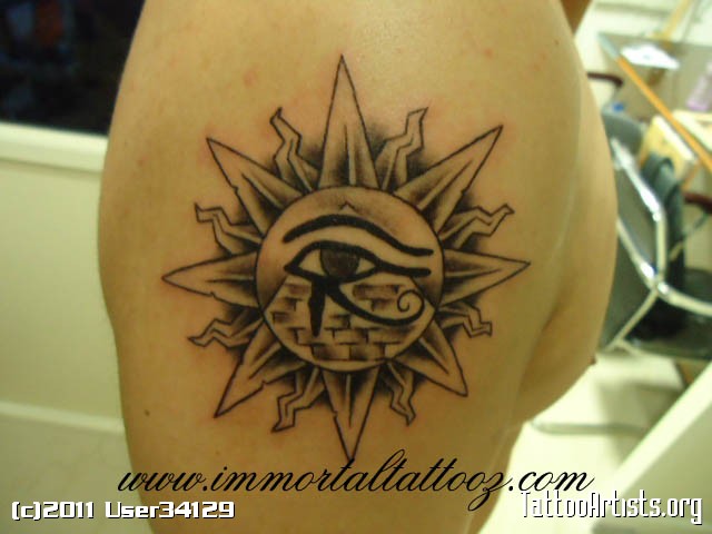 Superb Horus Eye With Pyramid In Sun Tattoo On Right Shoulder