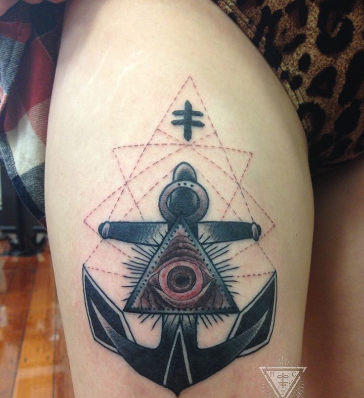 Terrific Dark Ink Triangle Eye On Anchor Tattoo On Thigh