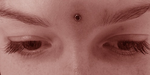 Third Eye Piercing Closeup Image