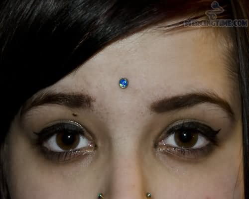 Third Eye Piercing With Beautiful Blue Stud