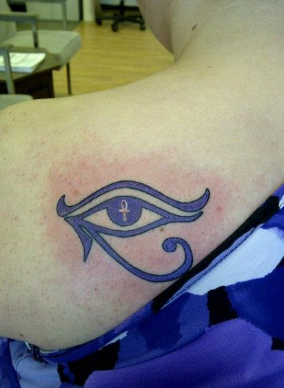 Tiny Ankh In Purple Ink Horus Eye Tattoo On Left Back Shoulder