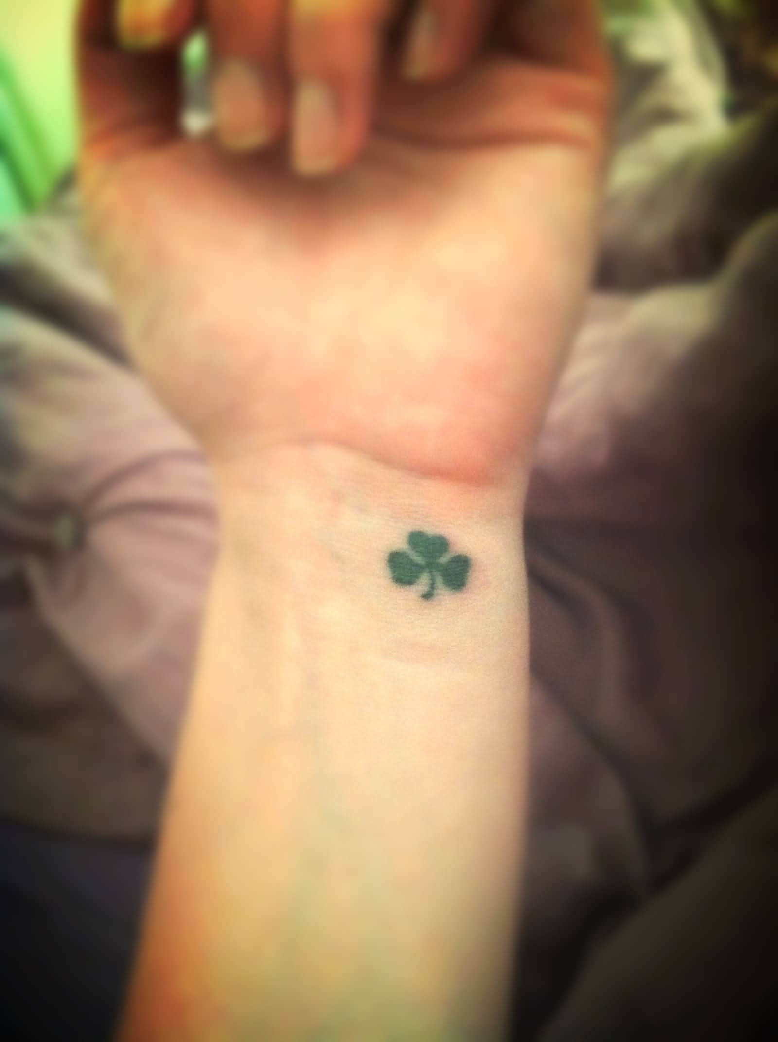 Tiny Green Shamrock Tattoo On Wrist
