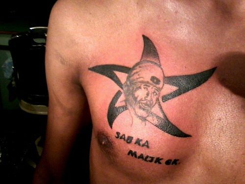 Unique Sai Baba Face Tattoo On Chest