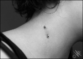 Vampire Bite Piercing With Vertical Barbell.