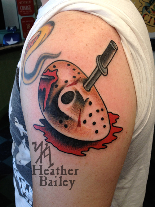Very Nice Knife In Jason Mask Eye Traditional Tattoo On Left Shoulder