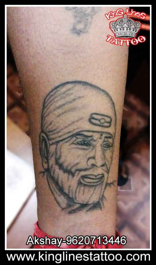 Very Nice Sai Baba Face Tattoo On Leg