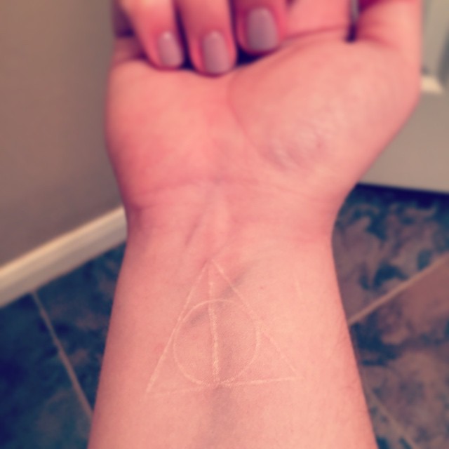 White Ink Deathly Hallows Tattoo On Wrist