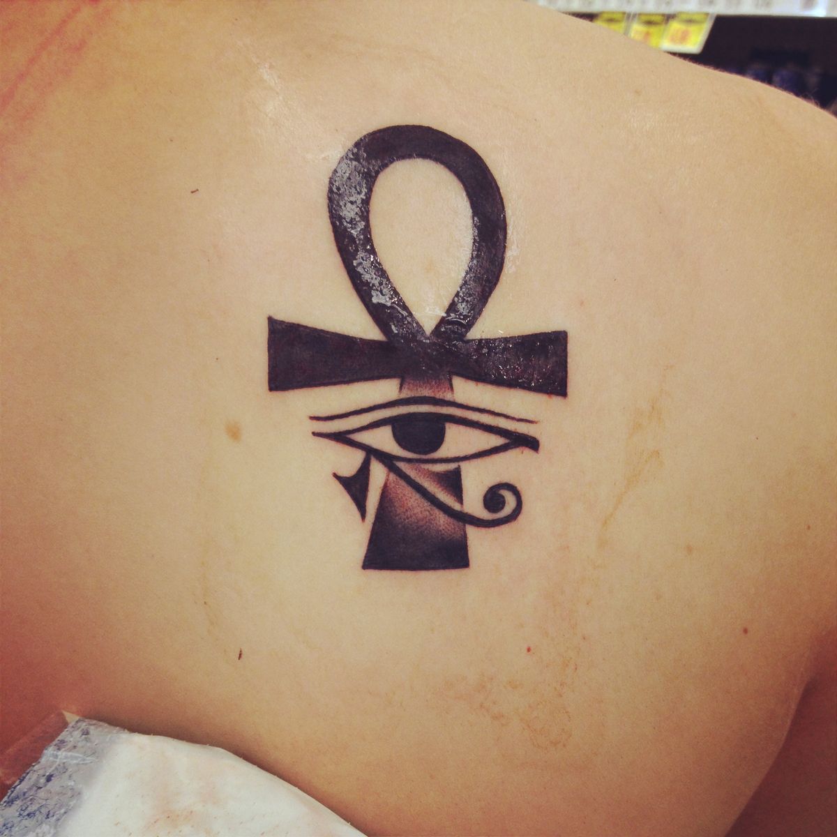 Wonderful Ankh Horus Eye Tattoo On Upper Back