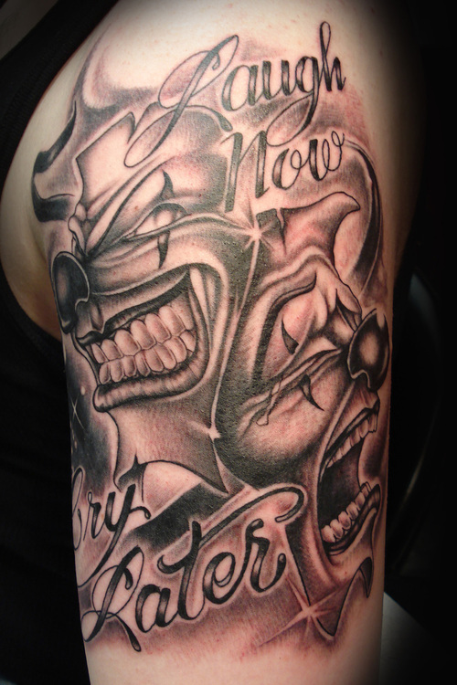 Wonderful Grey Ink Jester Faces Logo Tattoo On Left Half Sleeve