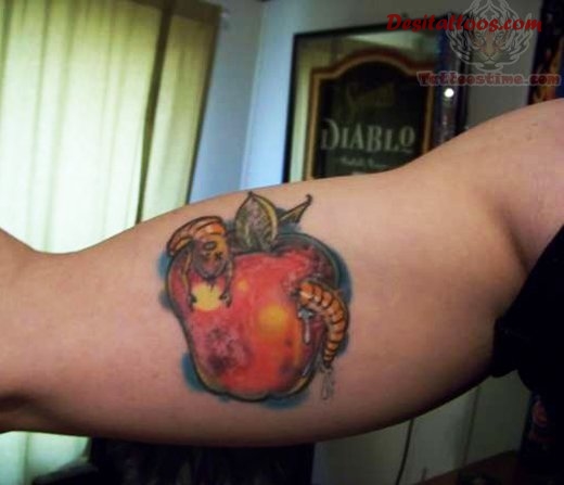Worm In Rotten Apple Tattoo On Bicep