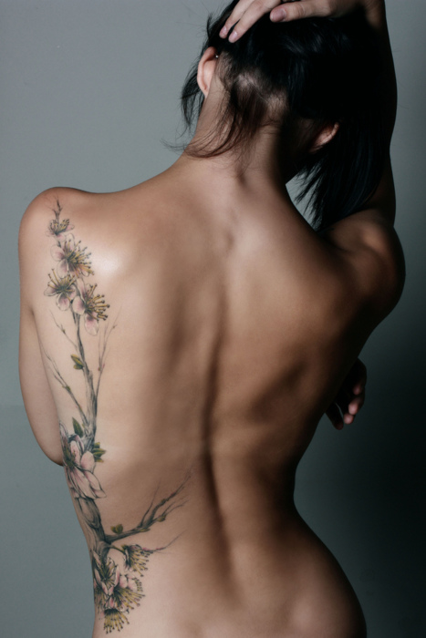 Amazing Back Floral Plant Tattoo For Girl