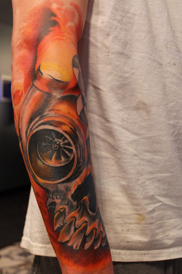 Amazing Big Skull And Turbo Tattoo On Right Arm Sleeve