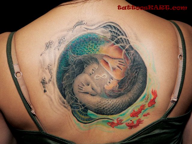 Amazing Mermaid Fishes Yin Yang Tattoo On Upper Back
