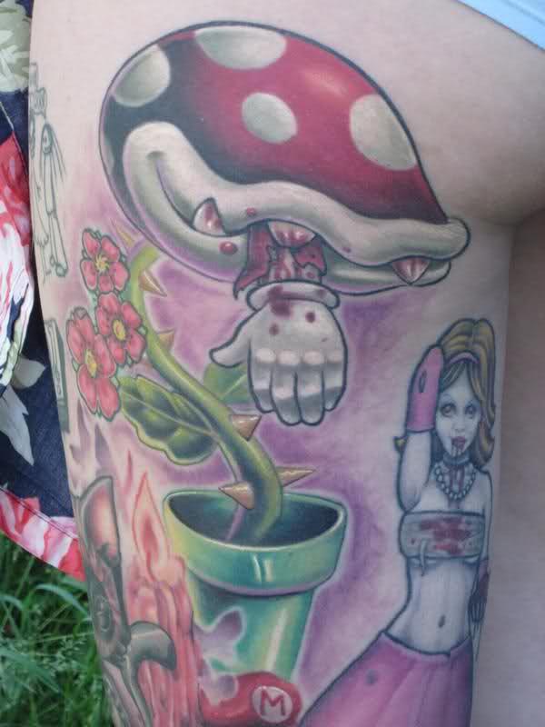 Amazing Nintendo And Flowers Plant Tattoo On Thigh