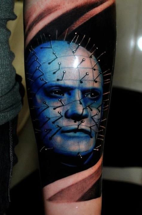 Awesome Blue Pinhead Face Tattoo On Arm