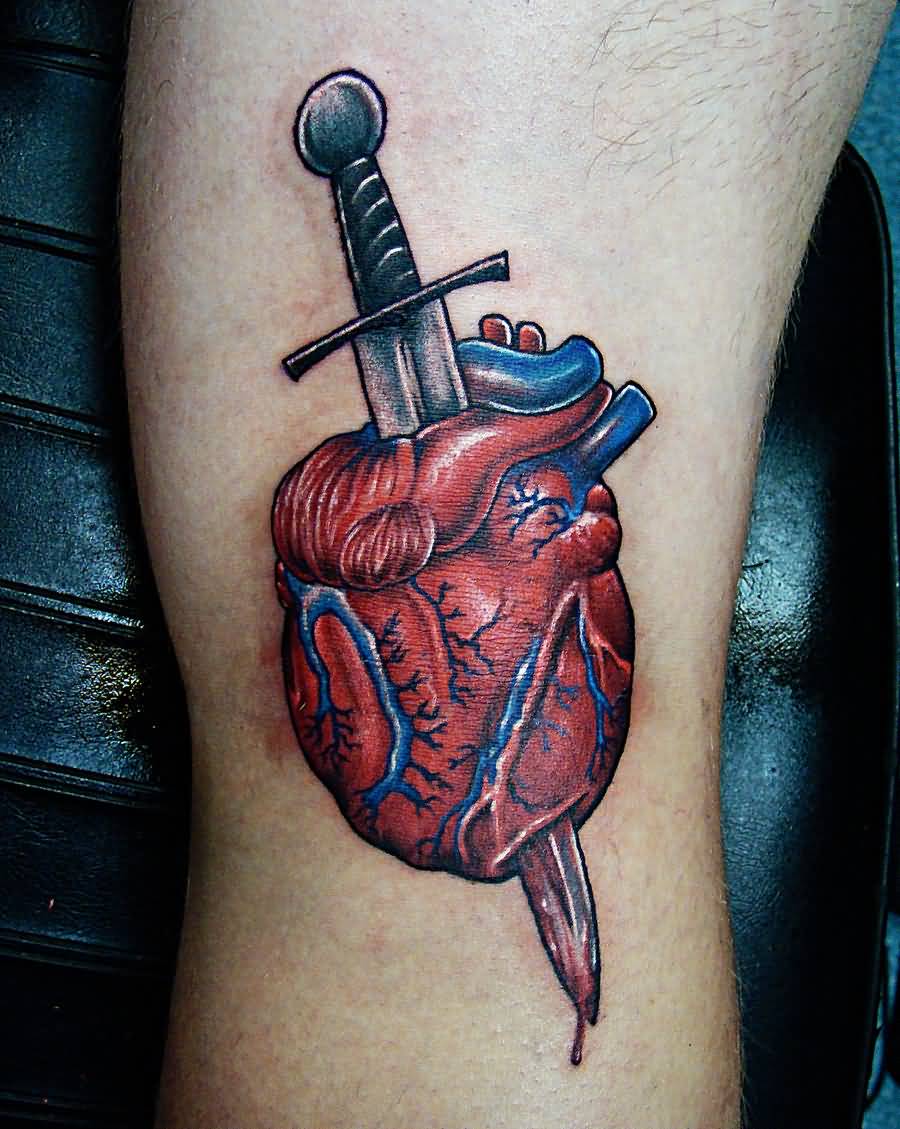 Awesome Colored Heart And Knife Tattoo