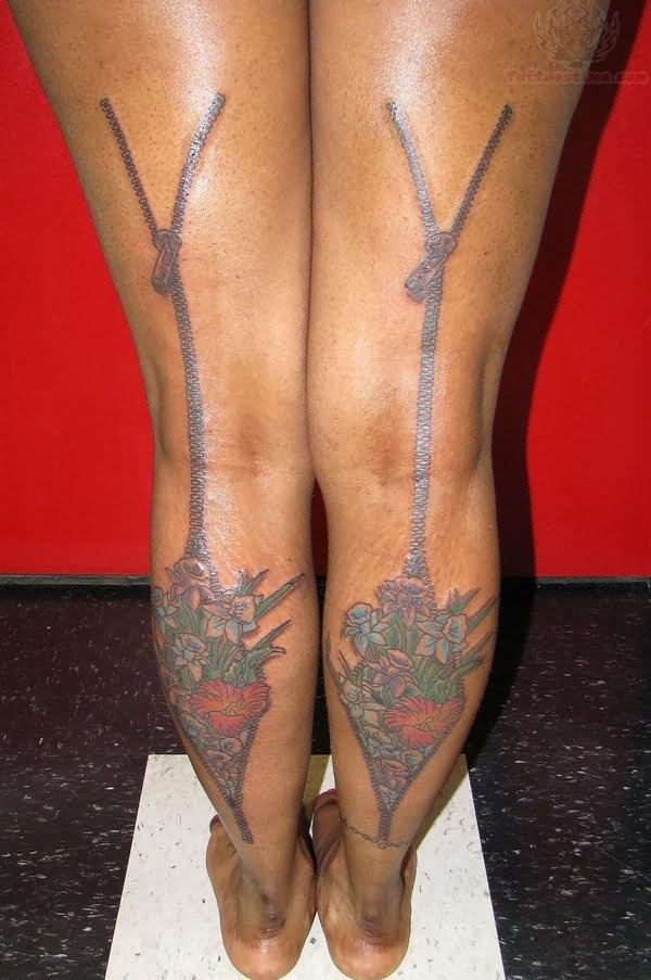 Back Leg Flowers And Zipper Matching Tattoos On Both Back Legs