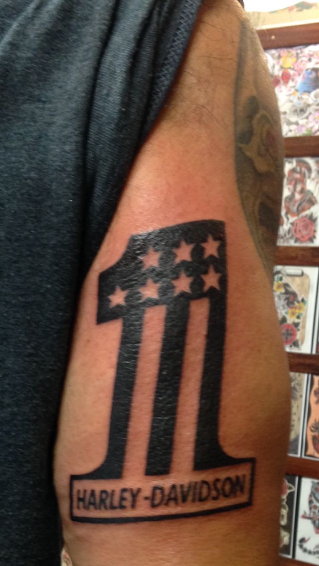Black American Flag On One Harley Logo Tattoo On Half Sleeve By Evan