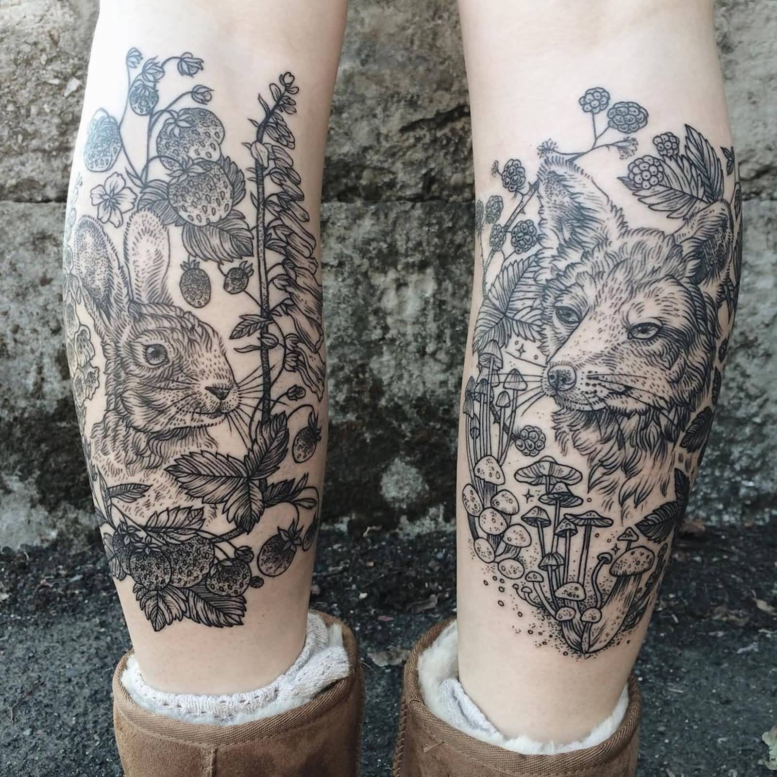 Black And Grey Bunny And Fox With Plants Tattoo On Back Leg