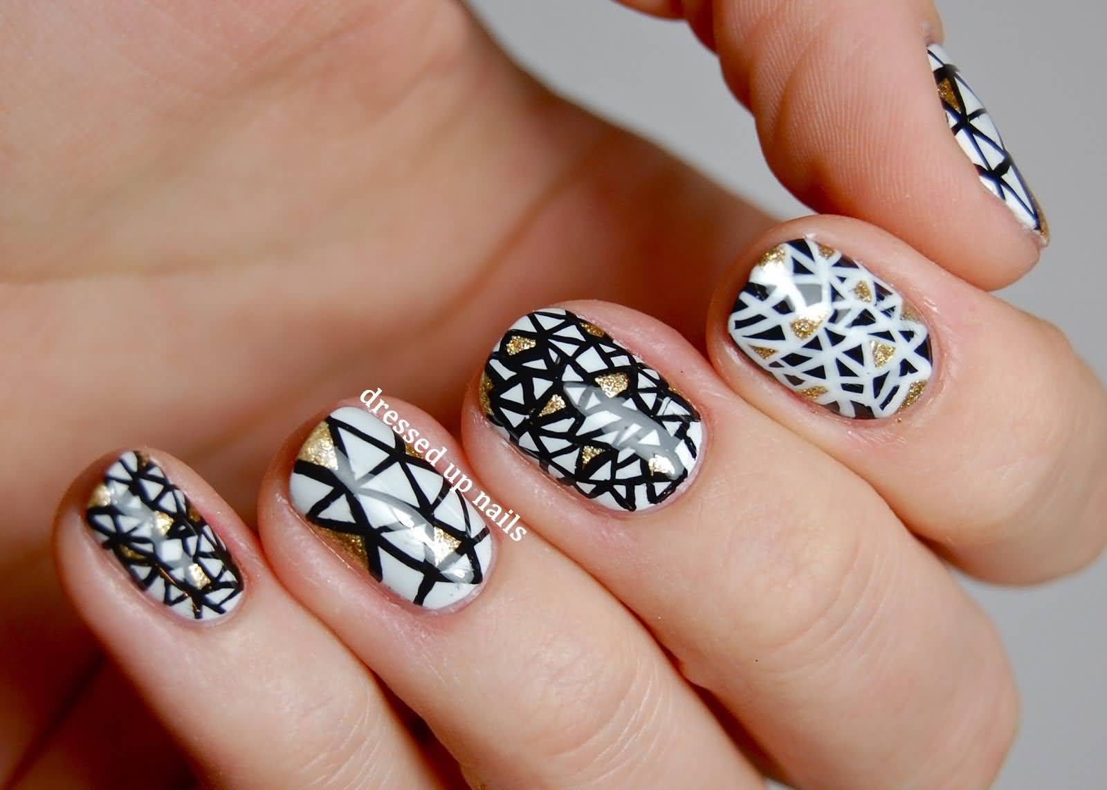 Black And White Triangles Design Nail Art With Golden Patches