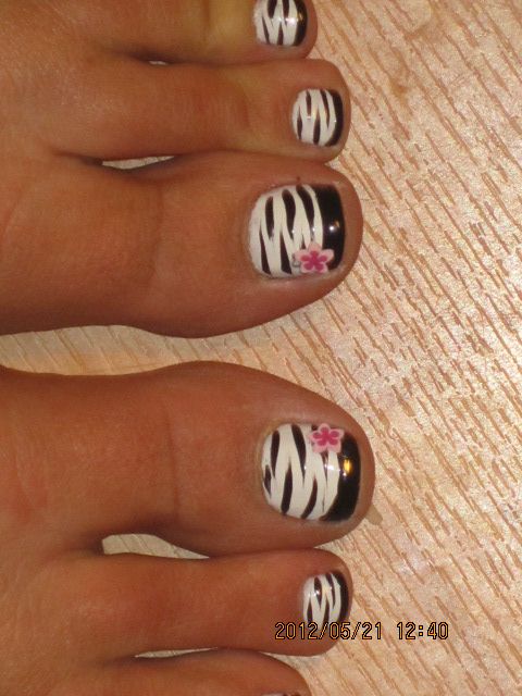 Black And White Zebra Print Toe Nail Art With Pink 3D Flower Design