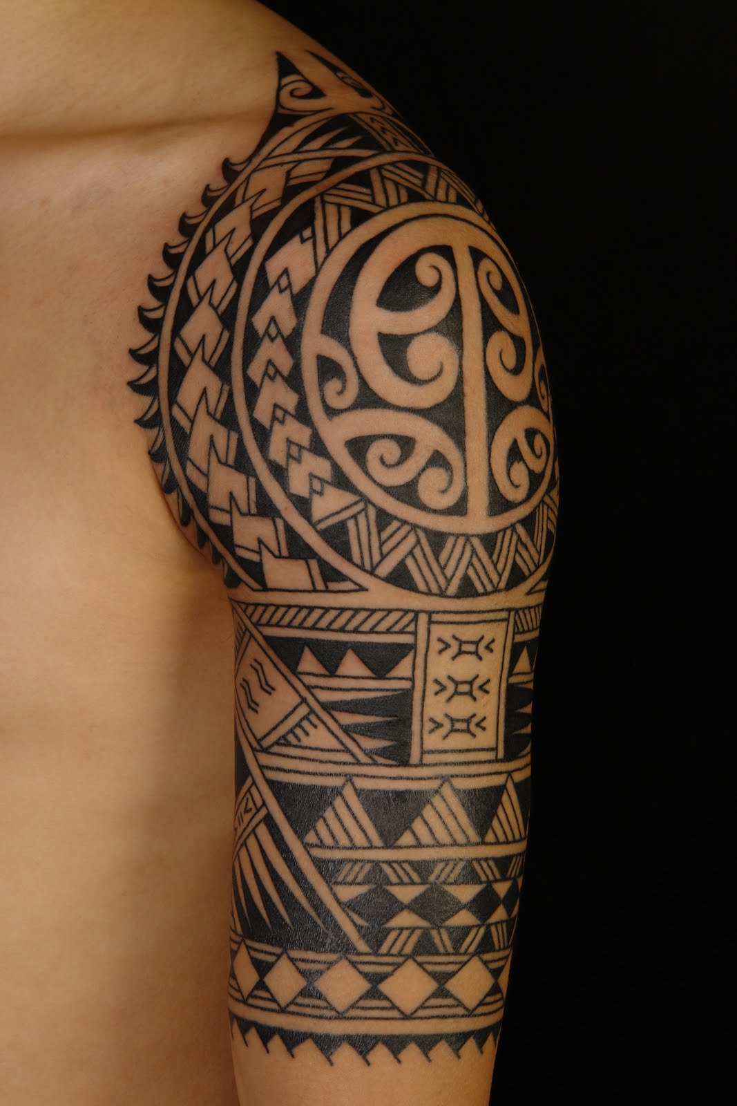 Black Ink Samoan Tattoo On Left Half Sleeve For Men
