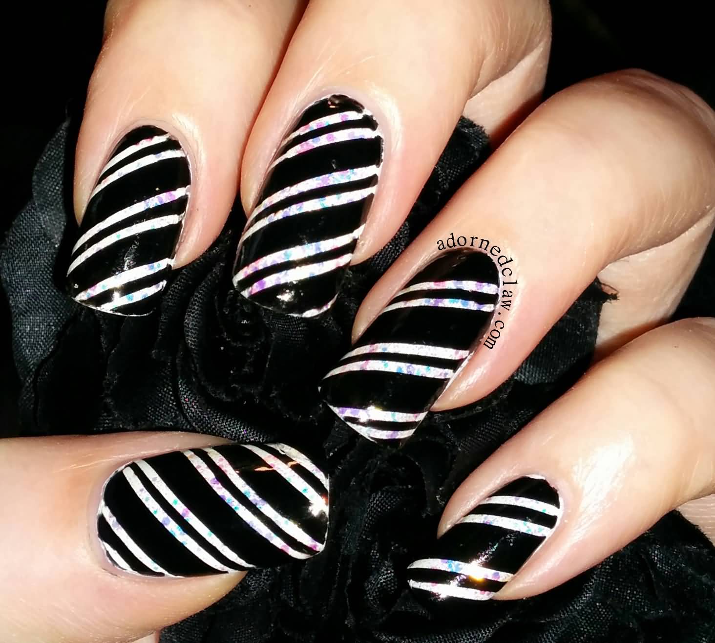 Black Nails With White Candy Cane Stripes Nail Art