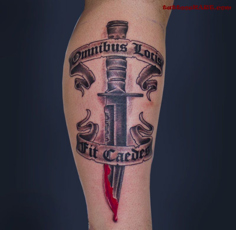 Bleeding Knife And Lettering Banner Tattoo On Leg