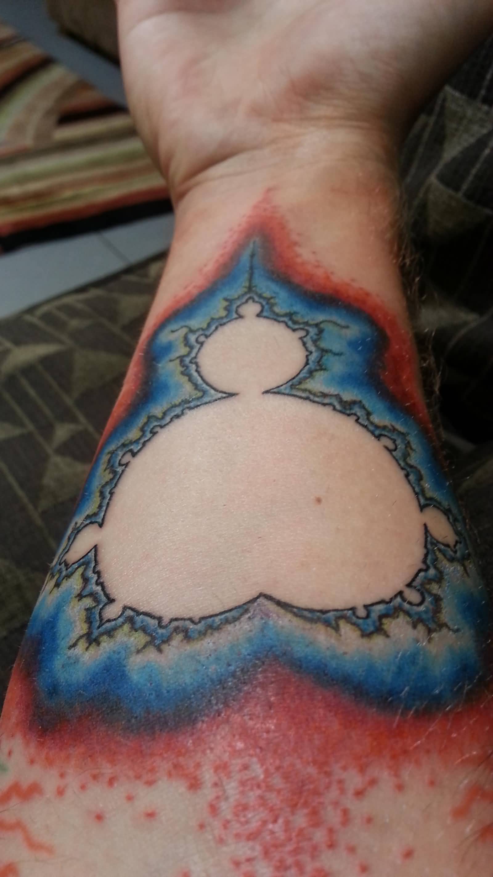 Blue And White Ink Mandelbrot Fractal Tattoo On Forearm