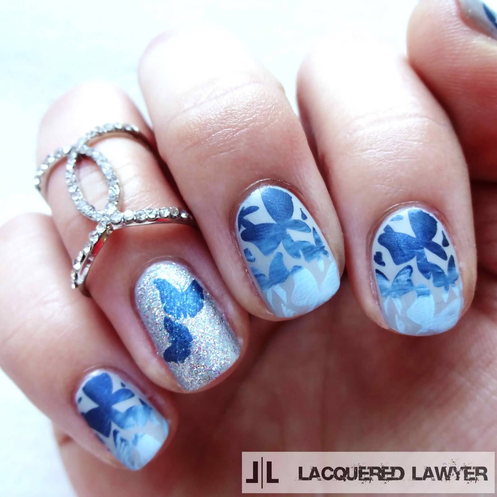 Blue Butterfly Nail Art On Silver Nails