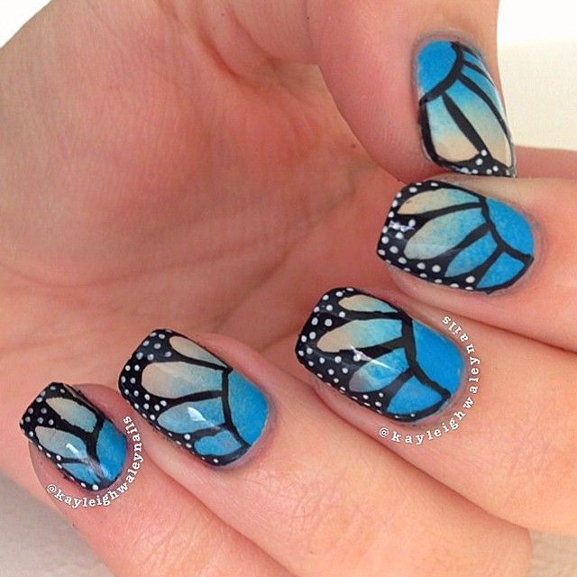 Blue Butterfly Nail Art With Black And White Polka Dots Design Idea