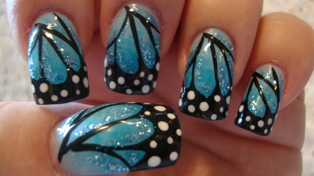 Blue Glitter Butterfly Wings Nail Art With Black And White Polka Dots Design