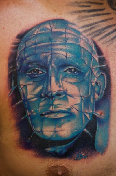 Blue Ink Pinhead Tattoo On Left Chest