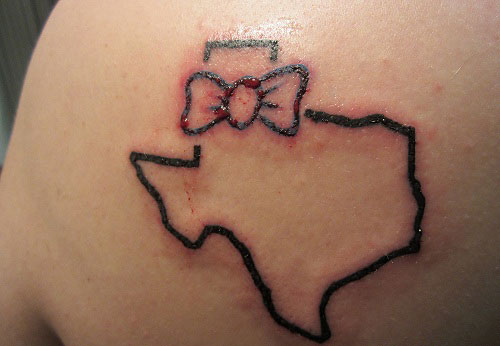 Bow And Texas Map Outline Tattoo On Left Back Shoulder