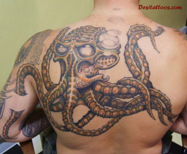 Brilliant Octopus Ripped Skin Tattoo On Upper Back