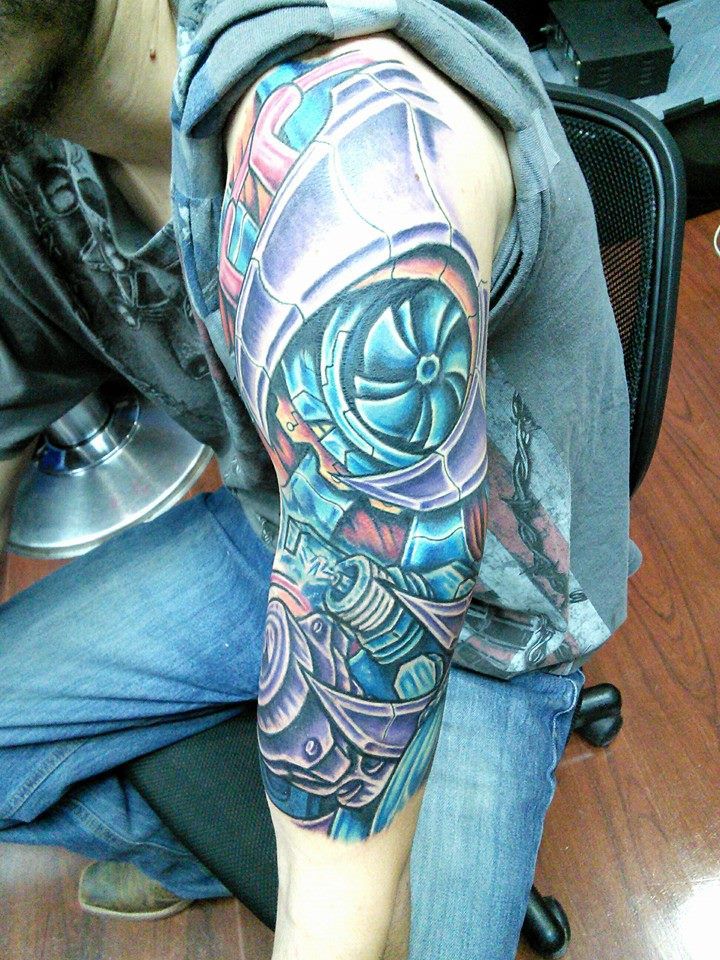 Classic Colorful Turbo Tattoo On Left Half Sleeve For Men