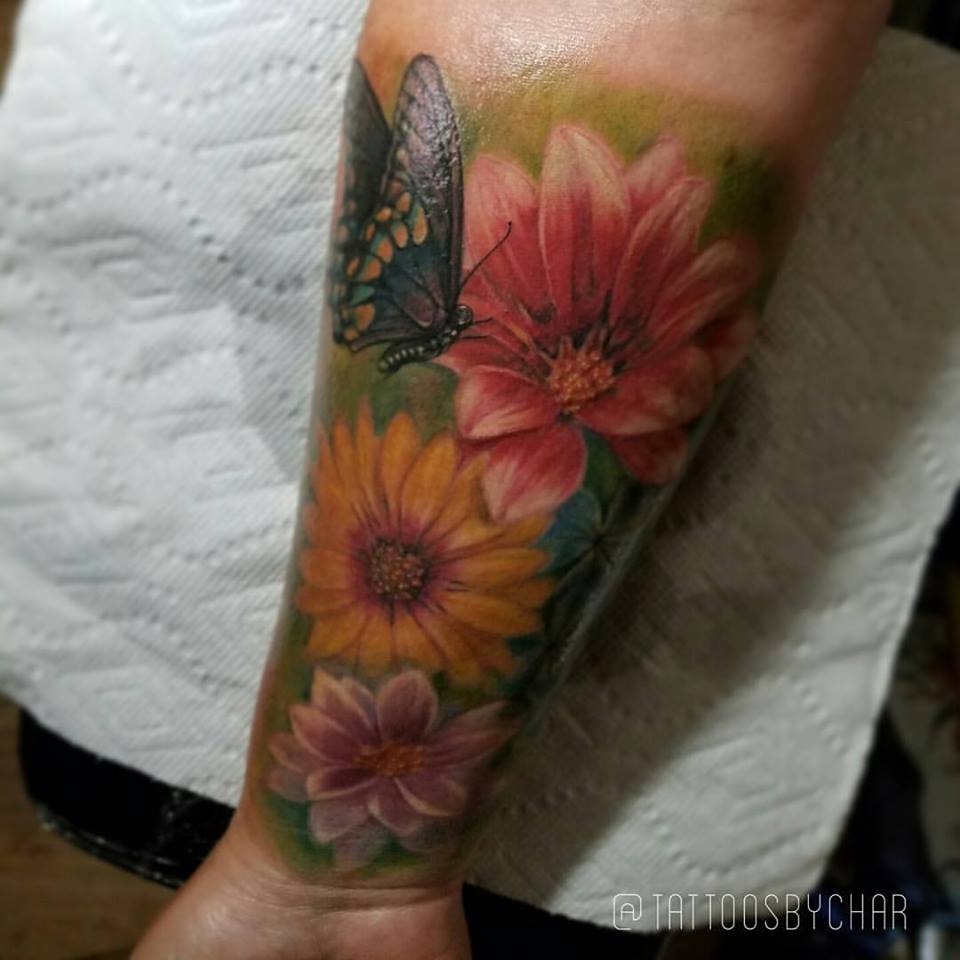 Colored Flowers And Butterfly Tattoo On Forearm by TattoosbyChar
