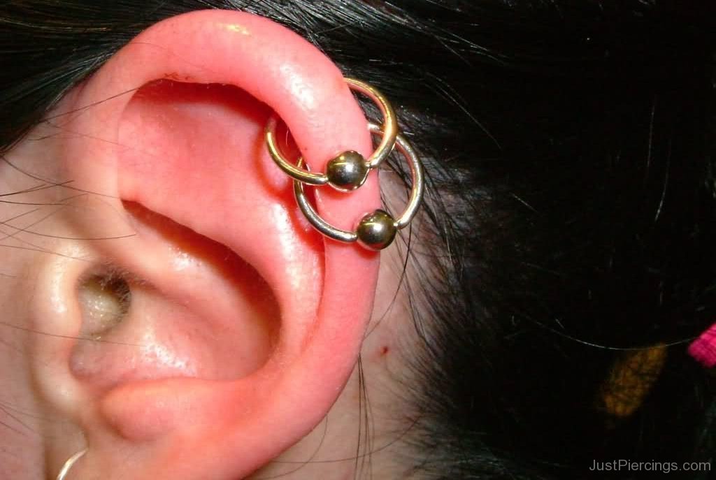 Dual Rim Piercing With Gold Bead Rings
