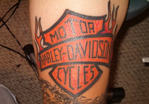 Flaming Harley Bike Logo Tattoo On Arm