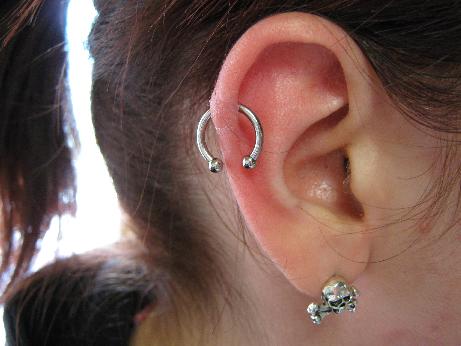 Girl With Right Ear Lobe And Rim Piercing by Daphneavena