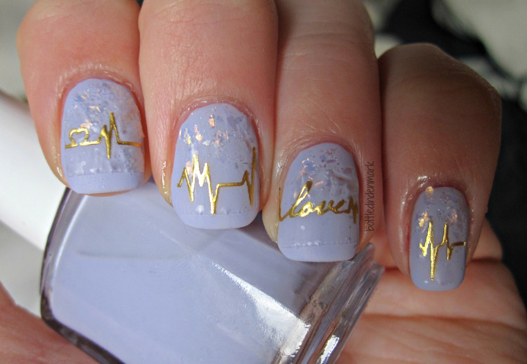 Golden Heartbeat Nail Art Design