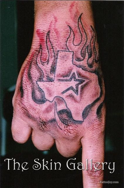 Grey Flaming Texas Tattoo On Hand