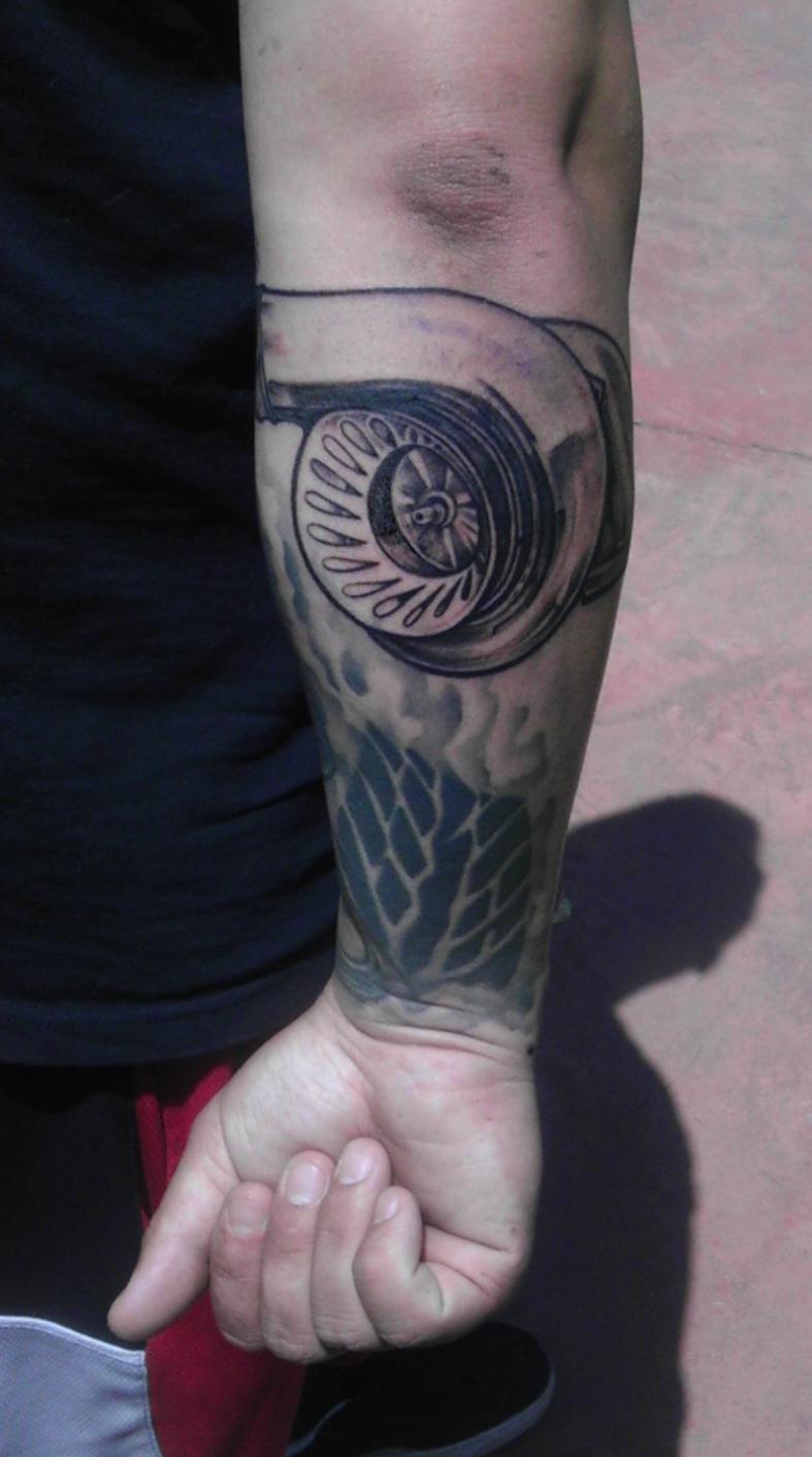 Grey Ink Turbo Tattoo On Man Right Forearm