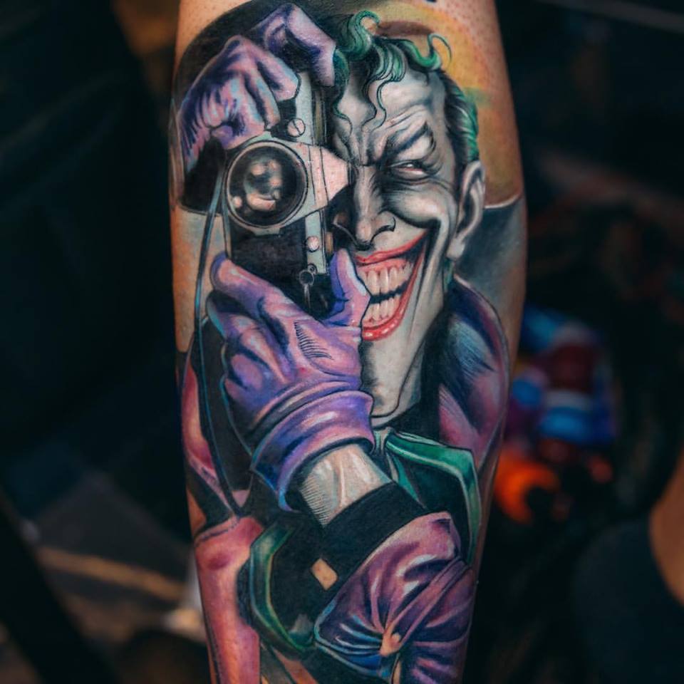 Joker With Camera Tattoo On Arm by Yomico Moreno