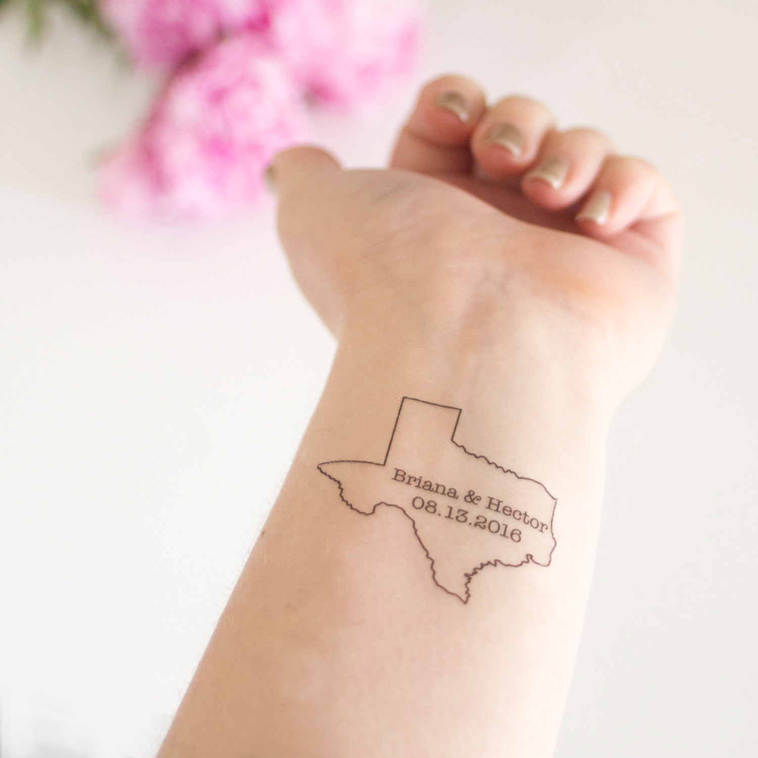 Lettering And Numerals On Texas Map Tattoo On Wrist