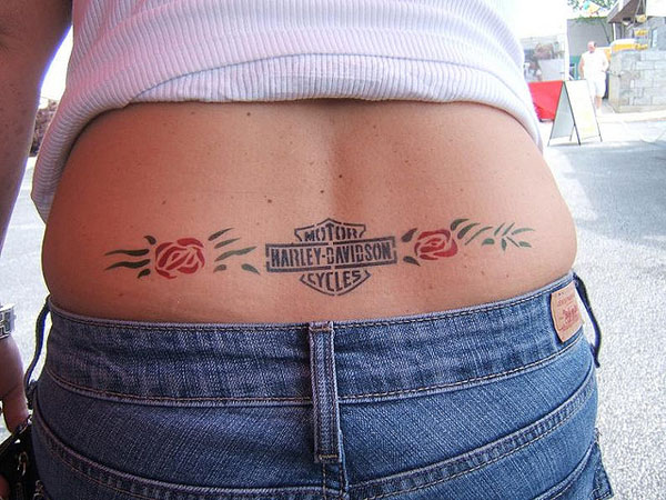 Lovely Flower And Harley Bike Logo Tattoo On Lower Back