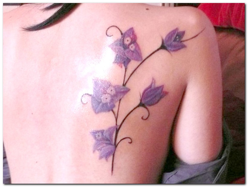 Lovely Orchid Flower Plant Tattoo On Right Back